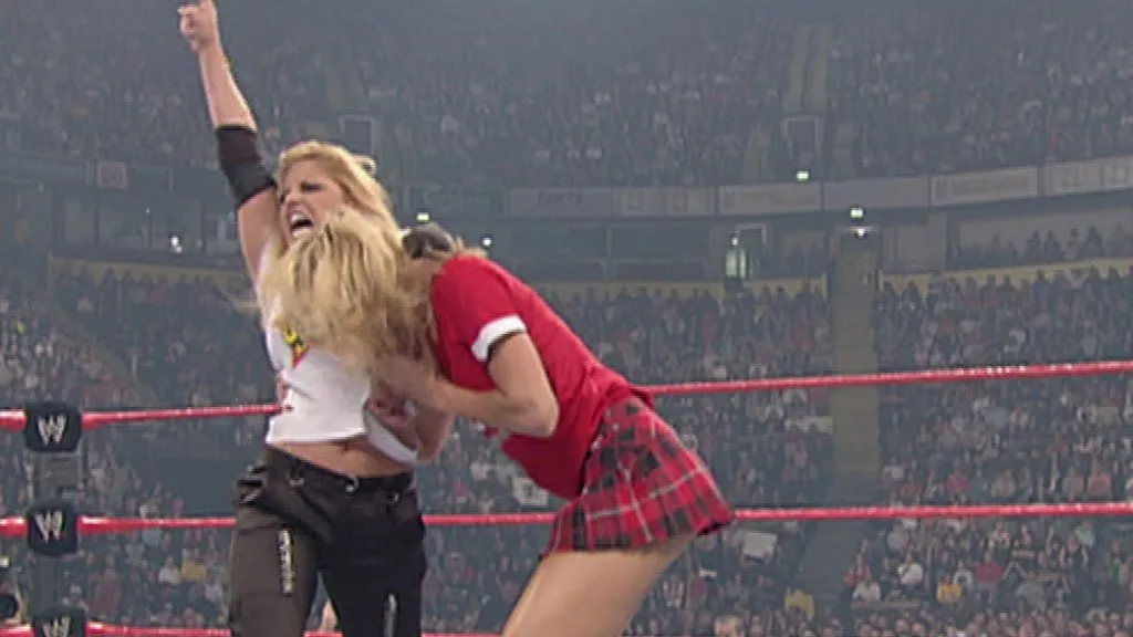 Stacy Keibler vs Trish Stratus Paddle On A Pole Spanking Match Results, Highlights, Winner & Video
